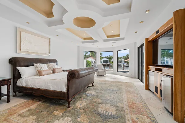a dining room with a table chairs and a floor to ceiling window