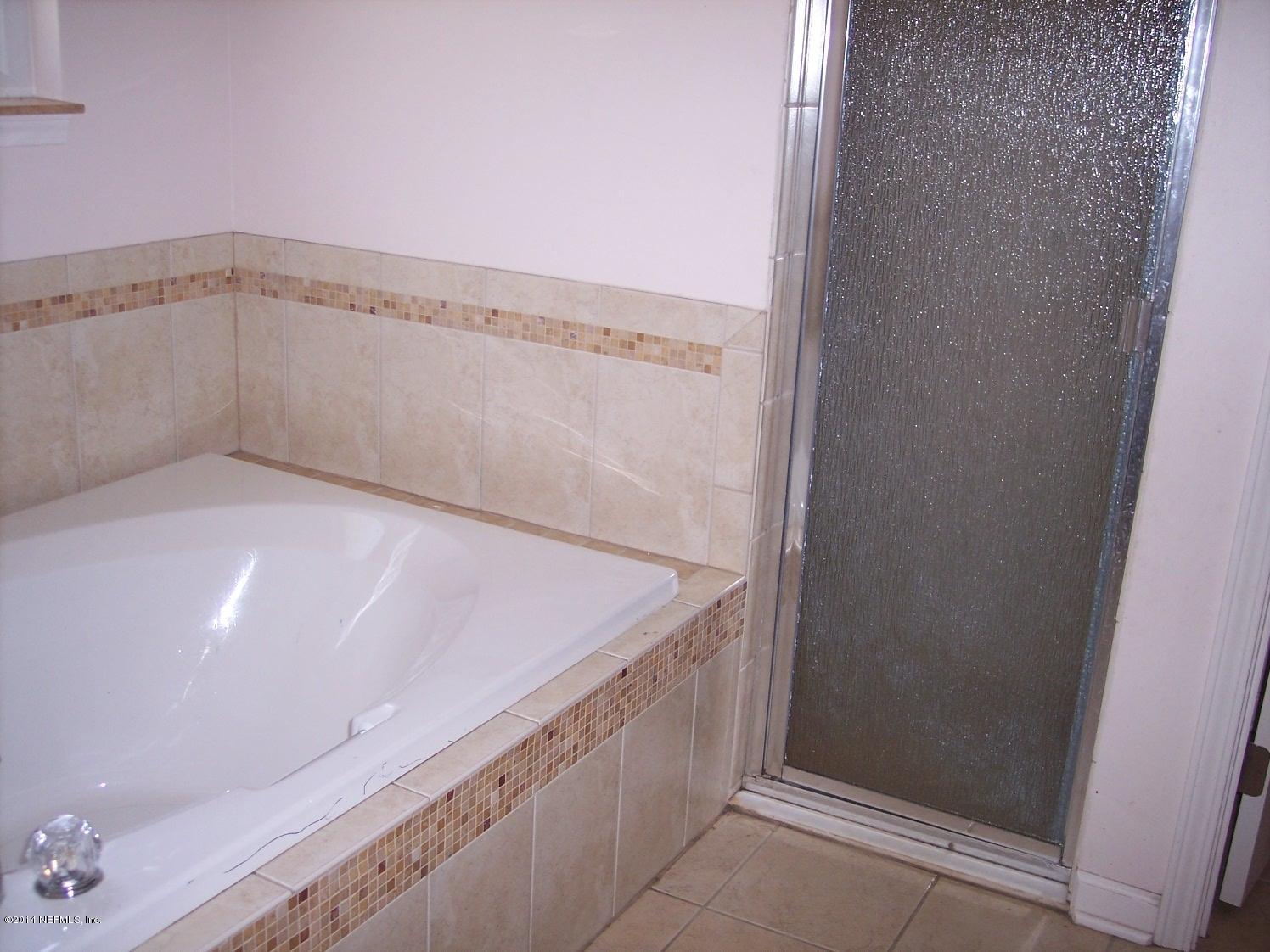 199 Brickyard Road Middleburg, FL 32068 - Photo 15 of 20 a bathroom with a shower and a sink