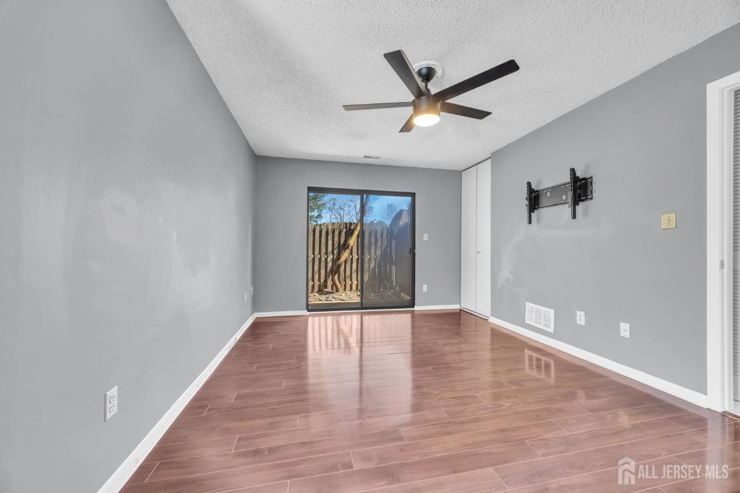 9 Carriage Place Edison, NJ 08820 - Photo 12 of 21 a view of a big room with wooden floor and windows