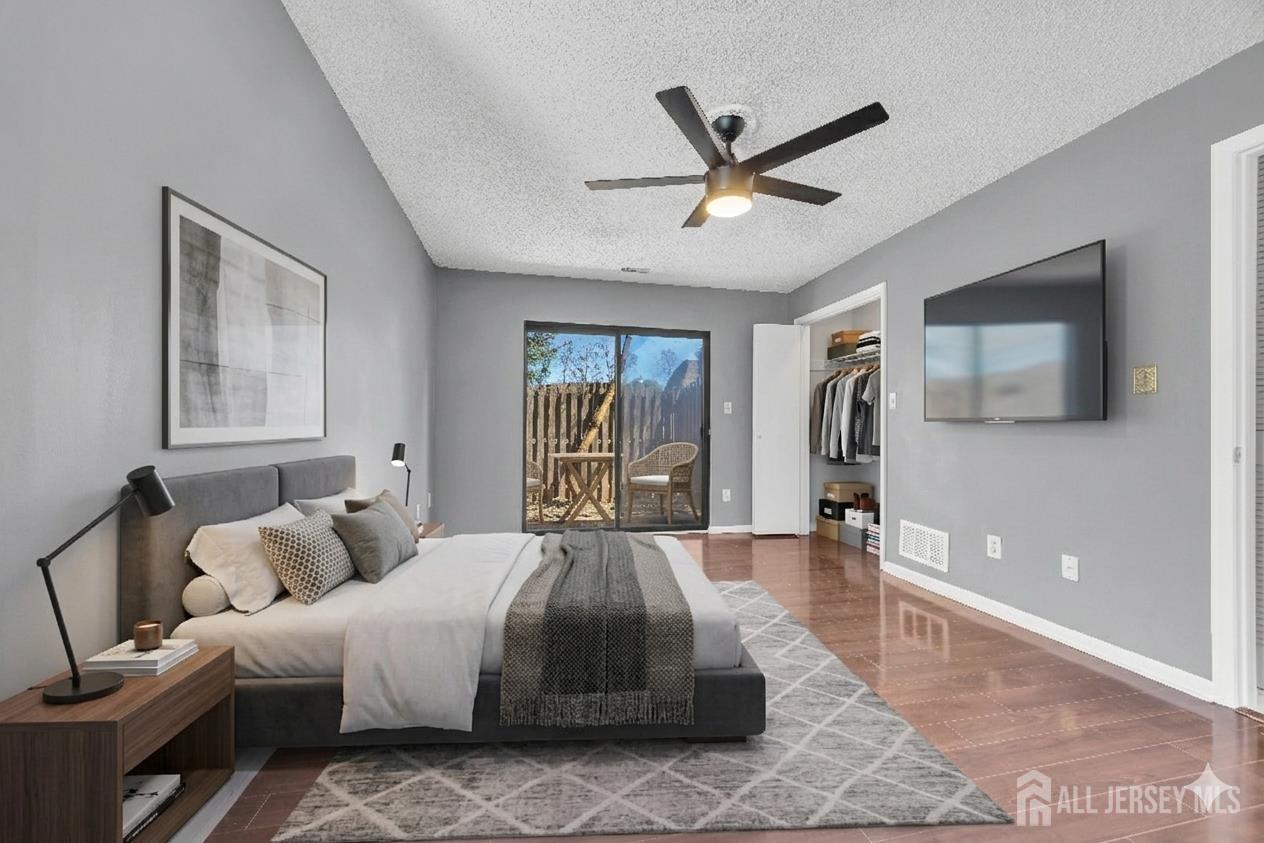 9 Carriage Place Edison, NJ 08820 - Photo 13 of 21 a spacious bedroom with a large bed and a window