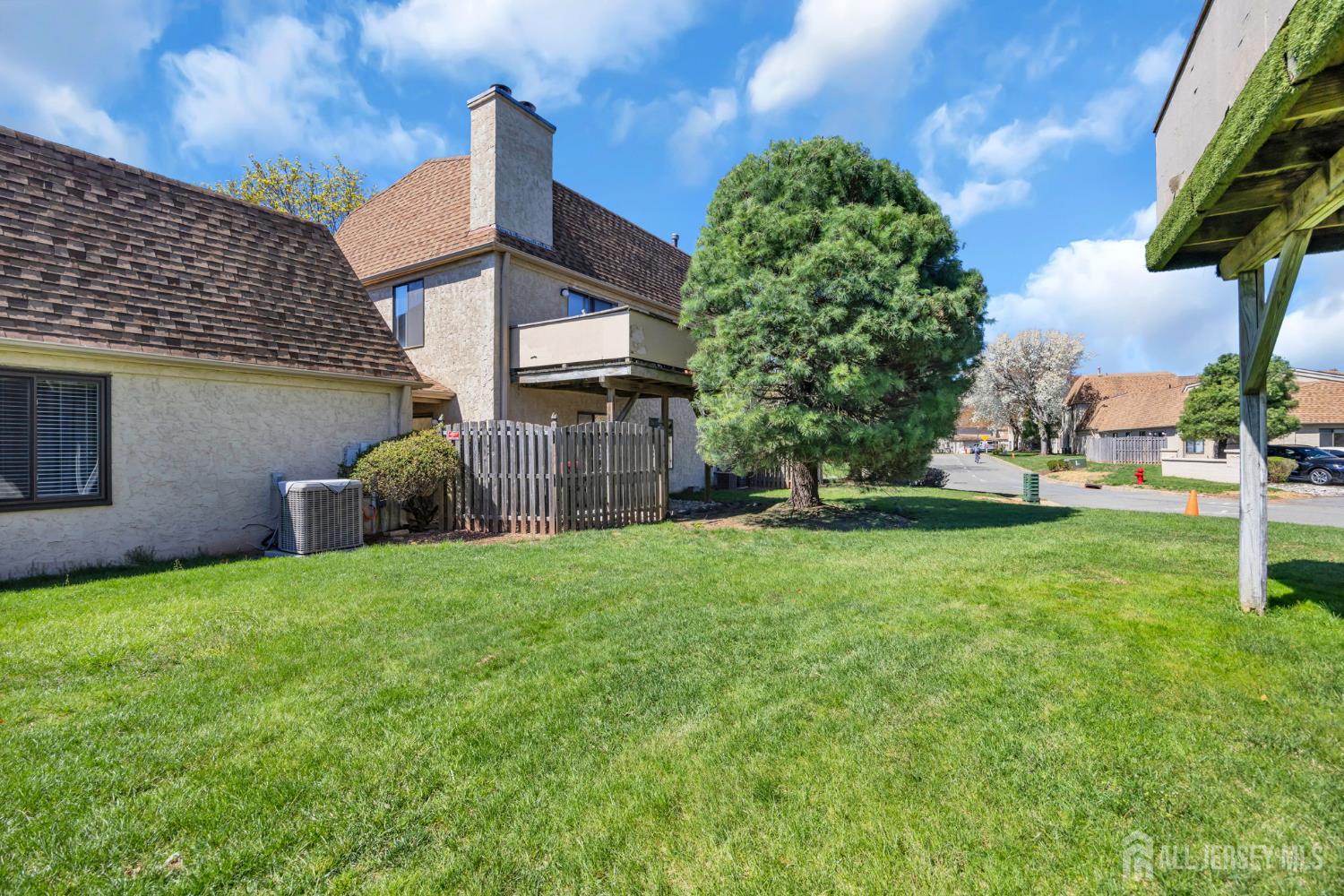 9 Carriage Place Edison, NJ 08820 - Photo 21 of 21 a front view of a house with garden