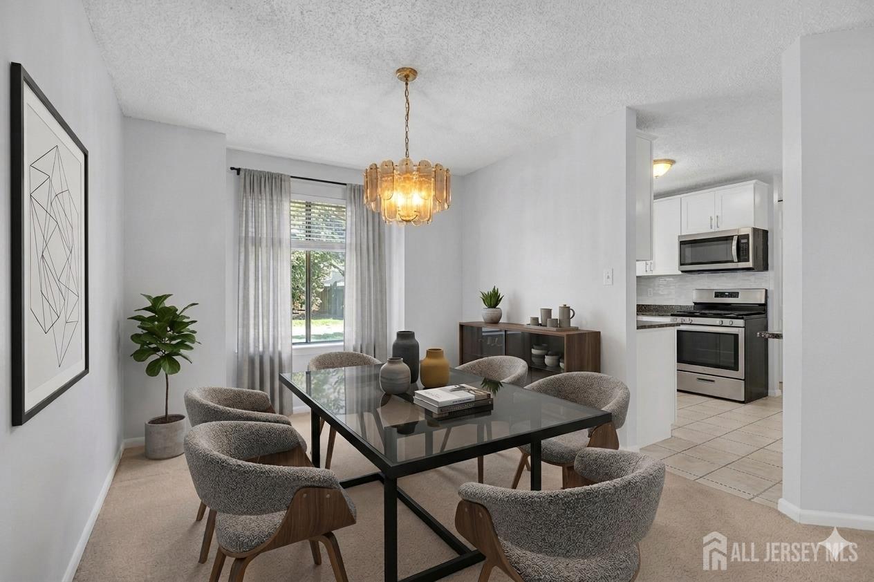 9 Carriage Place Edison, NJ 08820 - Photo 7 of 21 a dining room with furniture and window