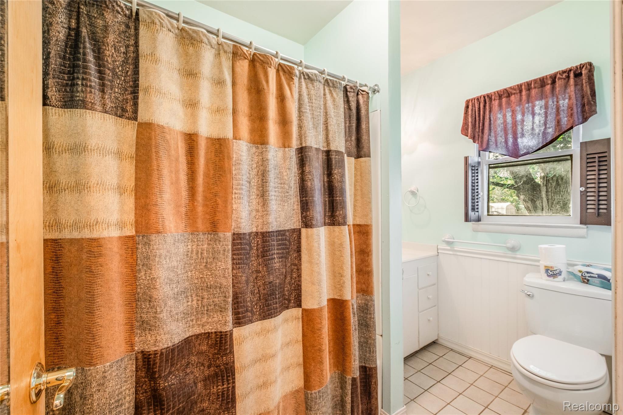 5447 North State Road Davison, MI 48423 - Photo 12 of 29 Full bathroom with vanity, tile patterned floors, and a shower with shower curtain