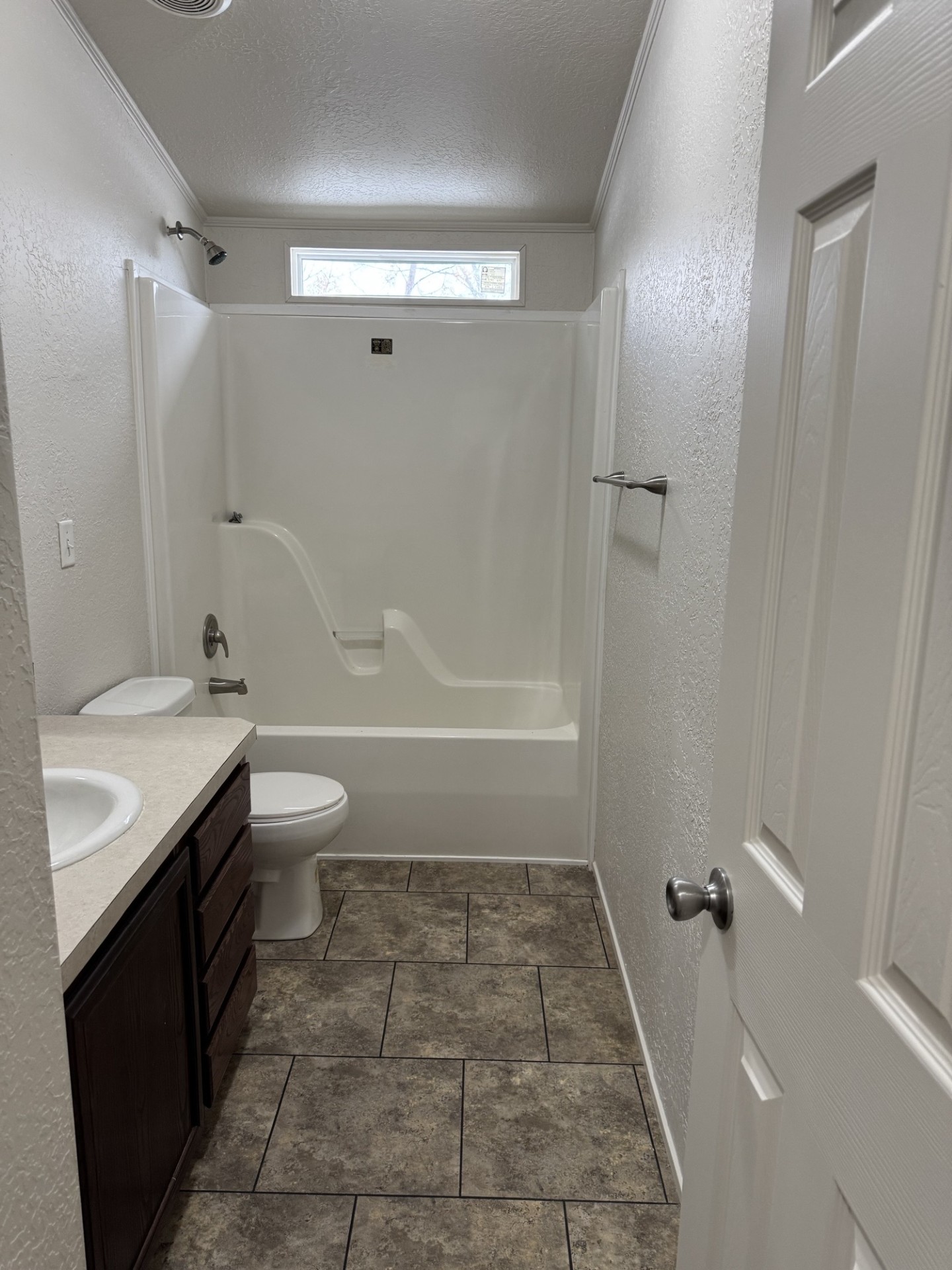8501 East State Highway 29 Georgetown, TX 78626 - Photo 14 of 24 a bathroom with a granite countertop sink toilet and shower
