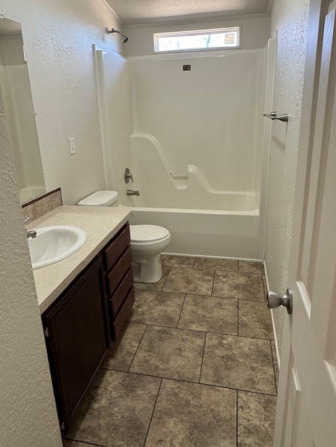 8501 East State Highway 29 Georgetown, TX 78626 - Photo 21 of 24 a bathroom with a granite countertop sink toilet and shower