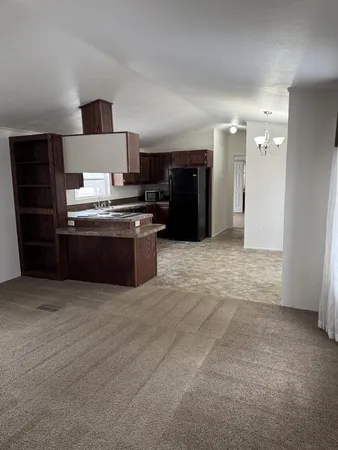 a room with a bed and a stove