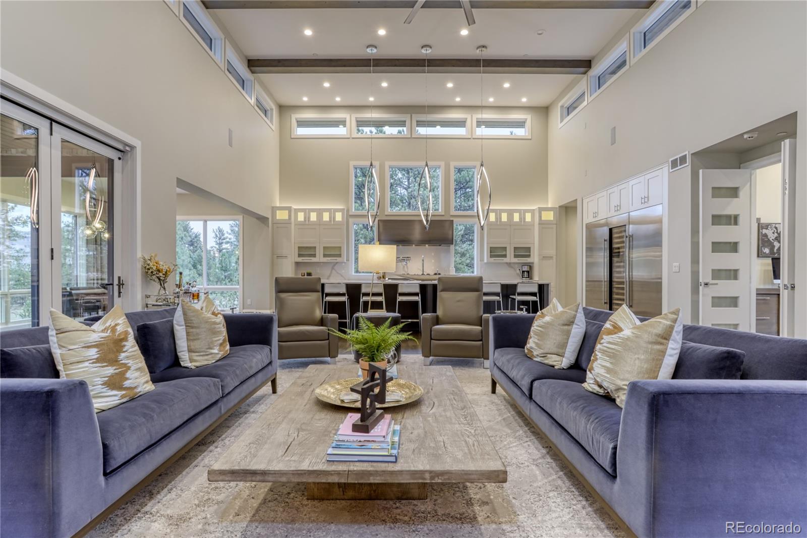 7865 Forest Keep Circle Parker, CO 80134 - Photo 10 of 40 a living room with furniture and a chandelier
