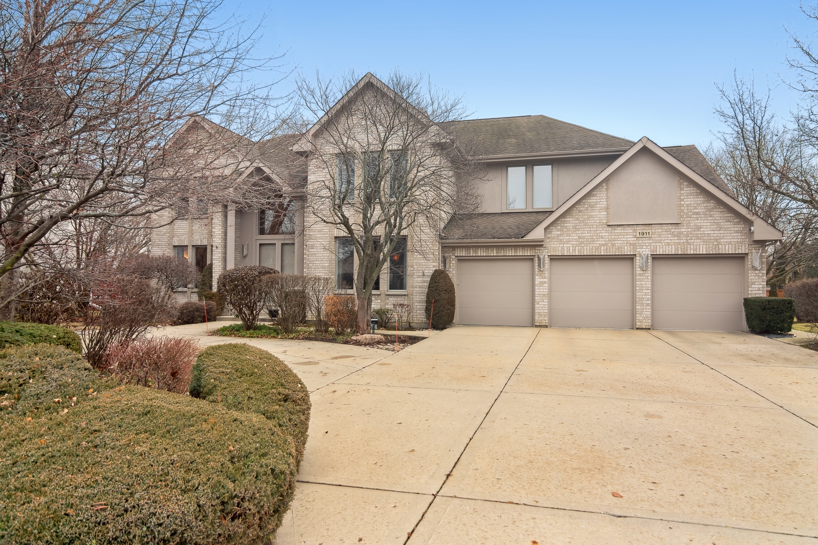 1911 Sheridan Road Buffalo Grove, IL 60089 - Photo 31 of 33 a front view of a house with a yard and garage