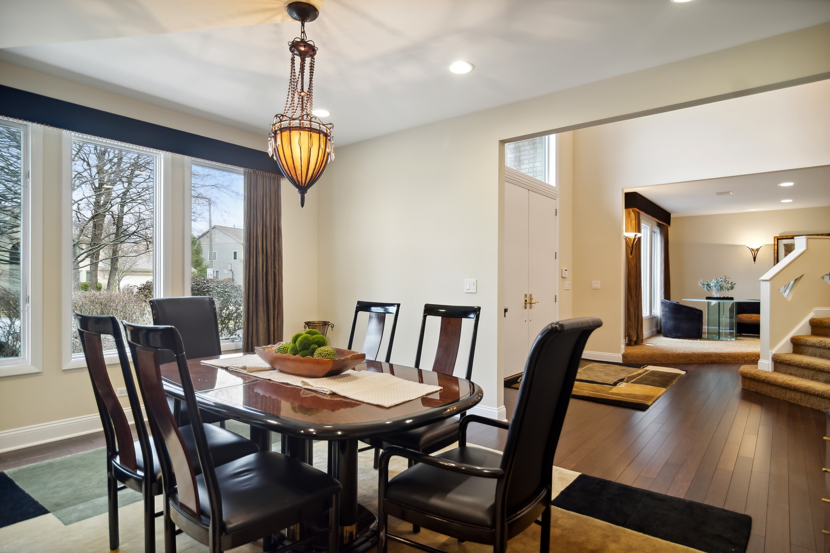 1911 Sheridan Road Buffalo Grove, IL 60089 - Photo 4 of 33 a view of a dining room with furniture wooden floor and chandelier