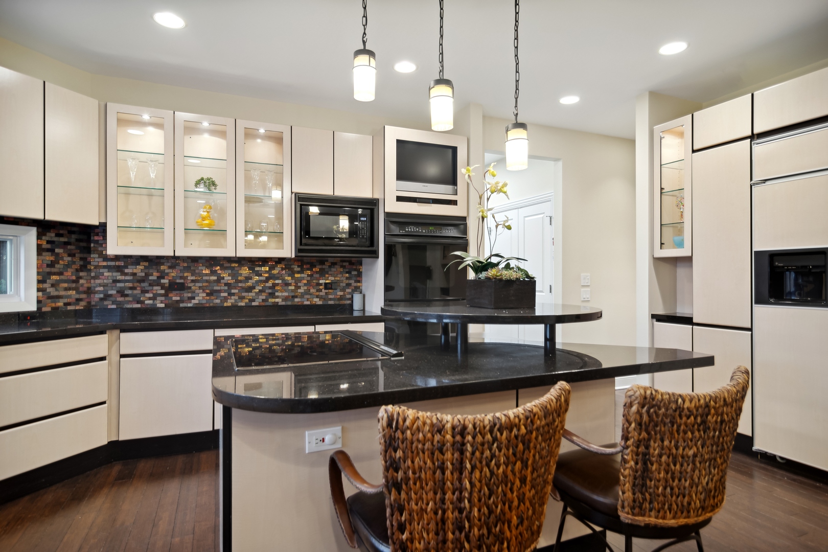 1911 Sheridan Road Buffalo Grove, IL 60089 - Photo 9 of 33 a kitchen with stainless steel appliances granite countertop a stove a sink a microwave a center island and furniture