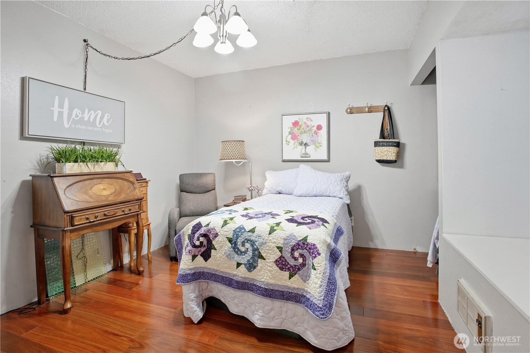 3506 Columbia Heights Road Longview, WA 98632 - Photo 13 of 22 a bedroom with a bed and wooden floor