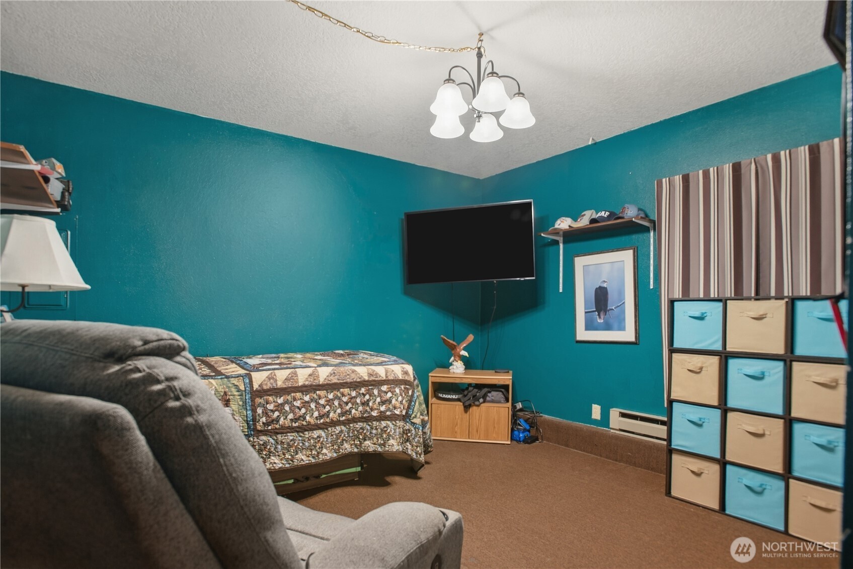 3506 Columbia Heights Road Longview, WA 98632 - Photo 17 of 22 a bedroom with furniture and a flat screen tv