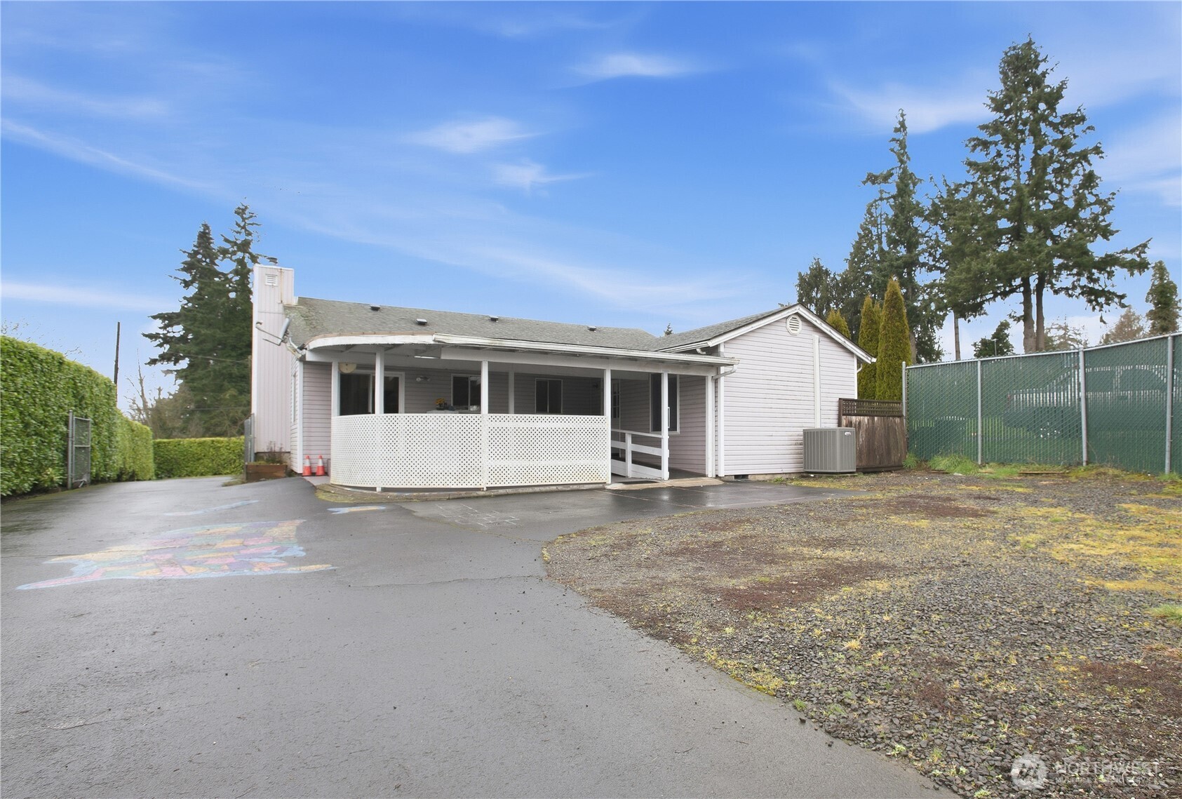 3506 Columbia Heights Road Longview, WA 98632 - Photo 19 of 22 a front view of a house with a garden and trees