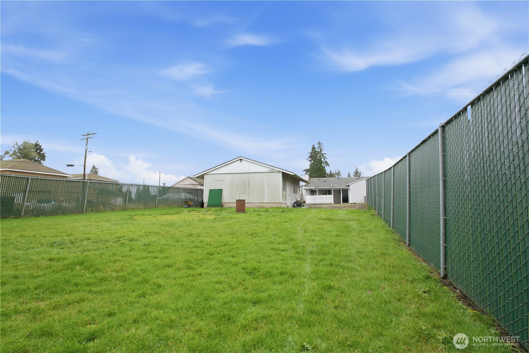 3506 Columbia Heights Road Longview, WA 98632 - Photo 21 of 22 a view of a tiny house with a yard and large trees