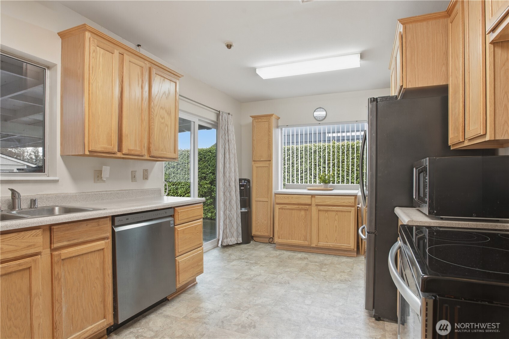 3506 Columbia Heights Road Longview, WA 98632 - Photo 10 of 22 a kitchen with a refrigerator and a sink