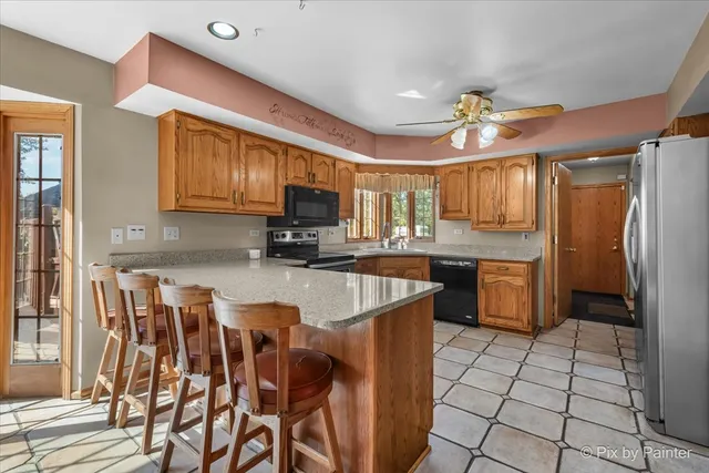 a kitchen with stainless steel appliances granite countertop a stove and a sink