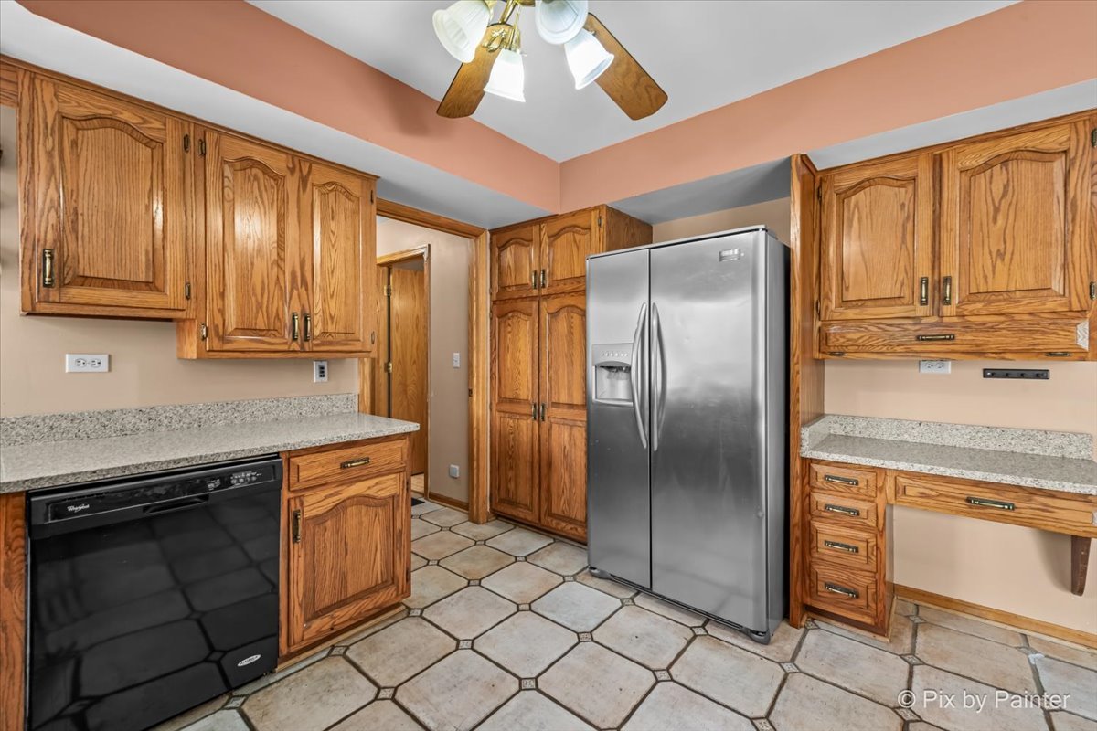 4319 Mc Cauley Road Woodstock, IL 60098 - Photo 13 of 52 a kitchen with stainless steel appliances granite countertop a refrigerator a stove and a sink with cabinets