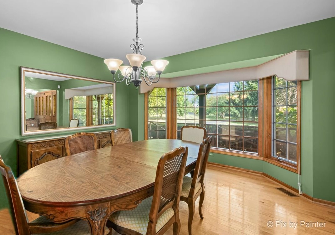 4319 Mc Cauley Road Woodstock, IL 60098 - Photo 14 of 52 a view of a dining room with furniture window and outside view