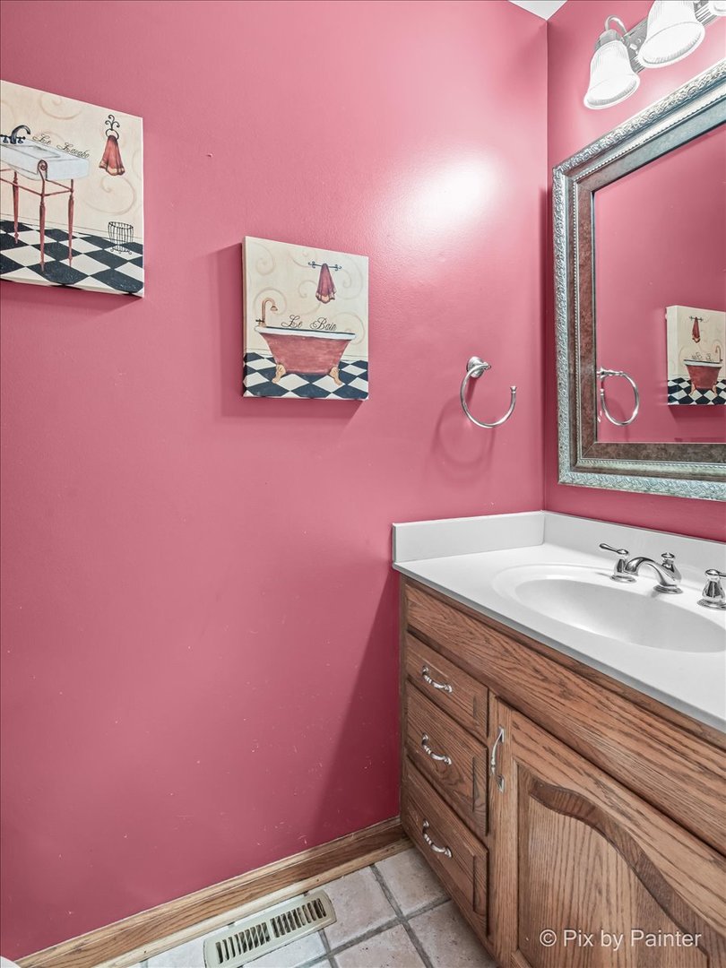 4319 Mc Cauley Road Woodstock, IL 60098 - Photo 15 of 52 a bathroom with a sink and a mirror