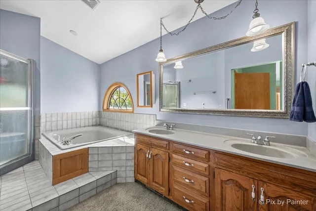 a bathroom with a sink a vanity and a mirror