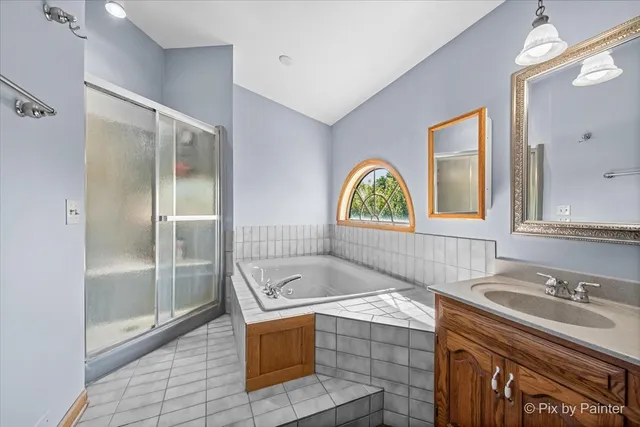 a bedroom with a bed window and a table