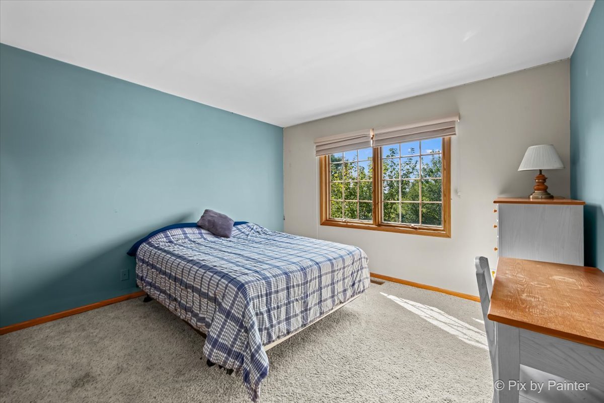4319 Mc Cauley Road Woodstock, IL 60098 - Photo 25 of 52 a bedroom with a bed and window