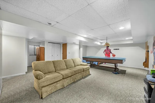 a bedroom with furniture and a chandelier