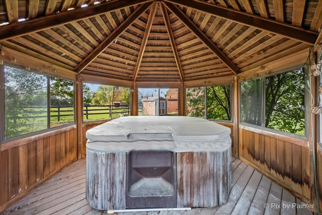 a view of a house with backyard outdoor seating and swimming pool