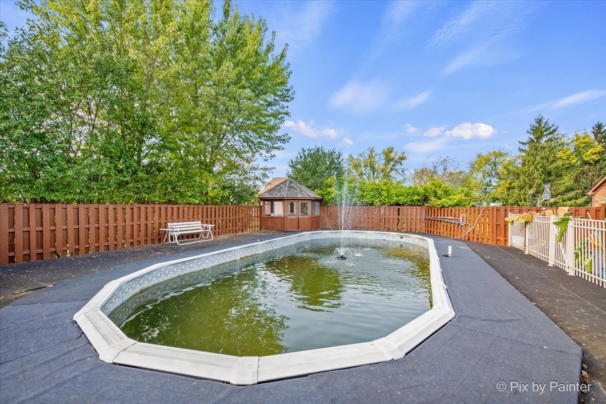 4319 Mc Cauley Road Woodstock, IL 60098 - Photo 34 of 52 a small pool with trees in the background