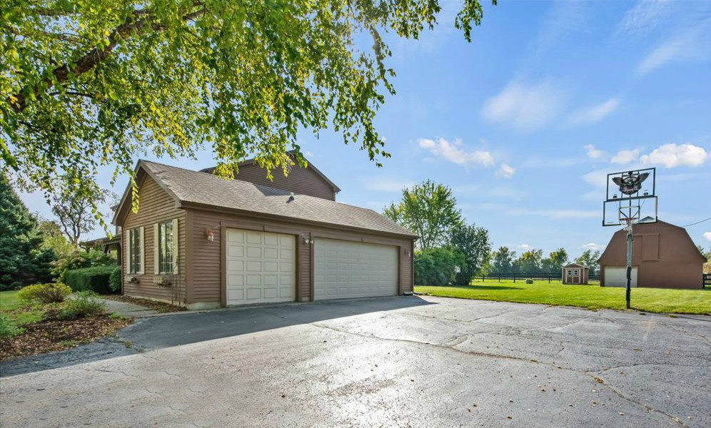 4319 Mc Cauley Road Woodstock, IL 60098 - Photo 35 of 52 a house view with a garden space