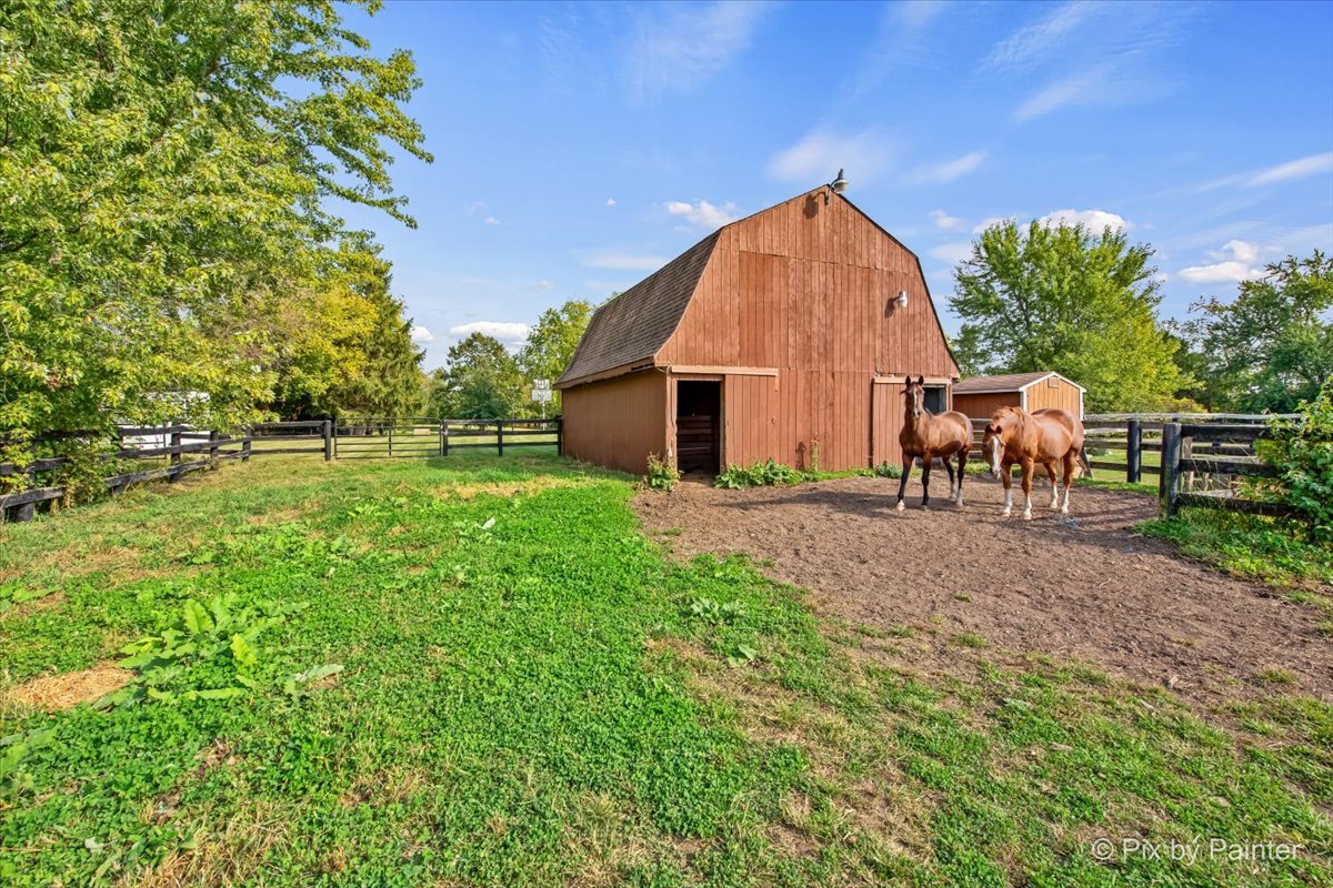 4319 Mc Cauley Road Woodstock, IL 60098 - Photo 38 of 52 a view of backyard with table and chairs
