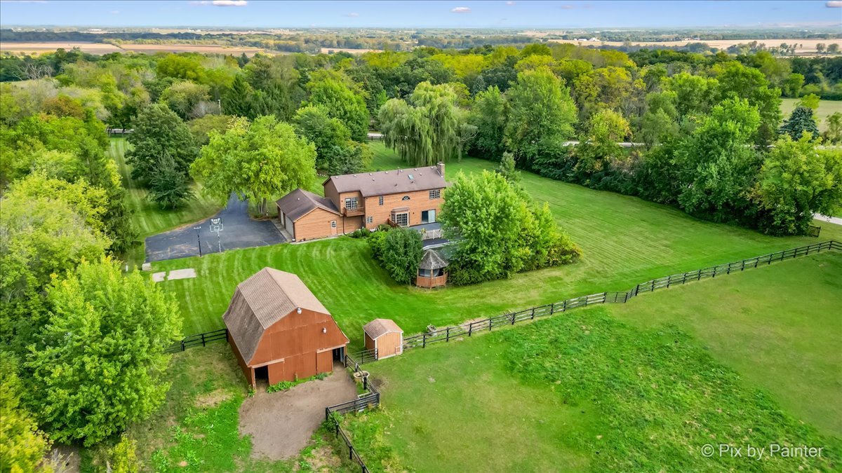 4319 Mc Cauley Road Woodstock, IL 60098 - Photo 41 of 52 an aerial view of a house with a yard