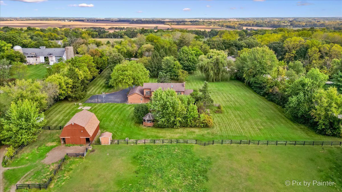 4319 Mc Cauley Road Woodstock, IL 60098 - Photo 42 of 52 a view of a city with lush green forest