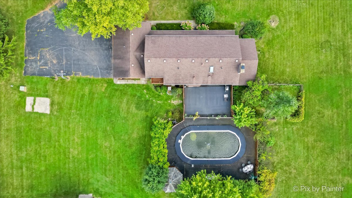 4319 Mc Cauley Road Woodstock, IL 60098 - Photo 47 of 52 an aerial view of a house with garden space and a swimming pool