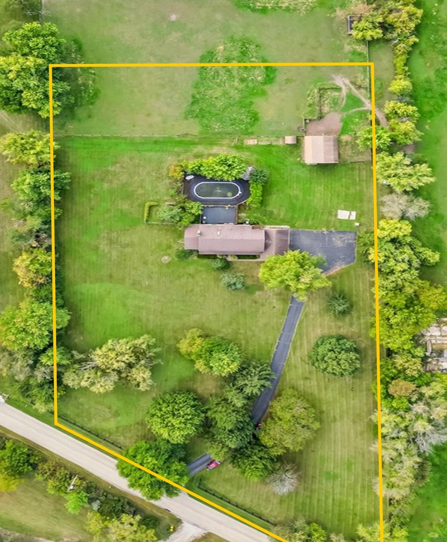 4319 Mc Cauley Road Woodstock, IL 60098 - Photo 49 of 52 a bathroom with a sink and mirror