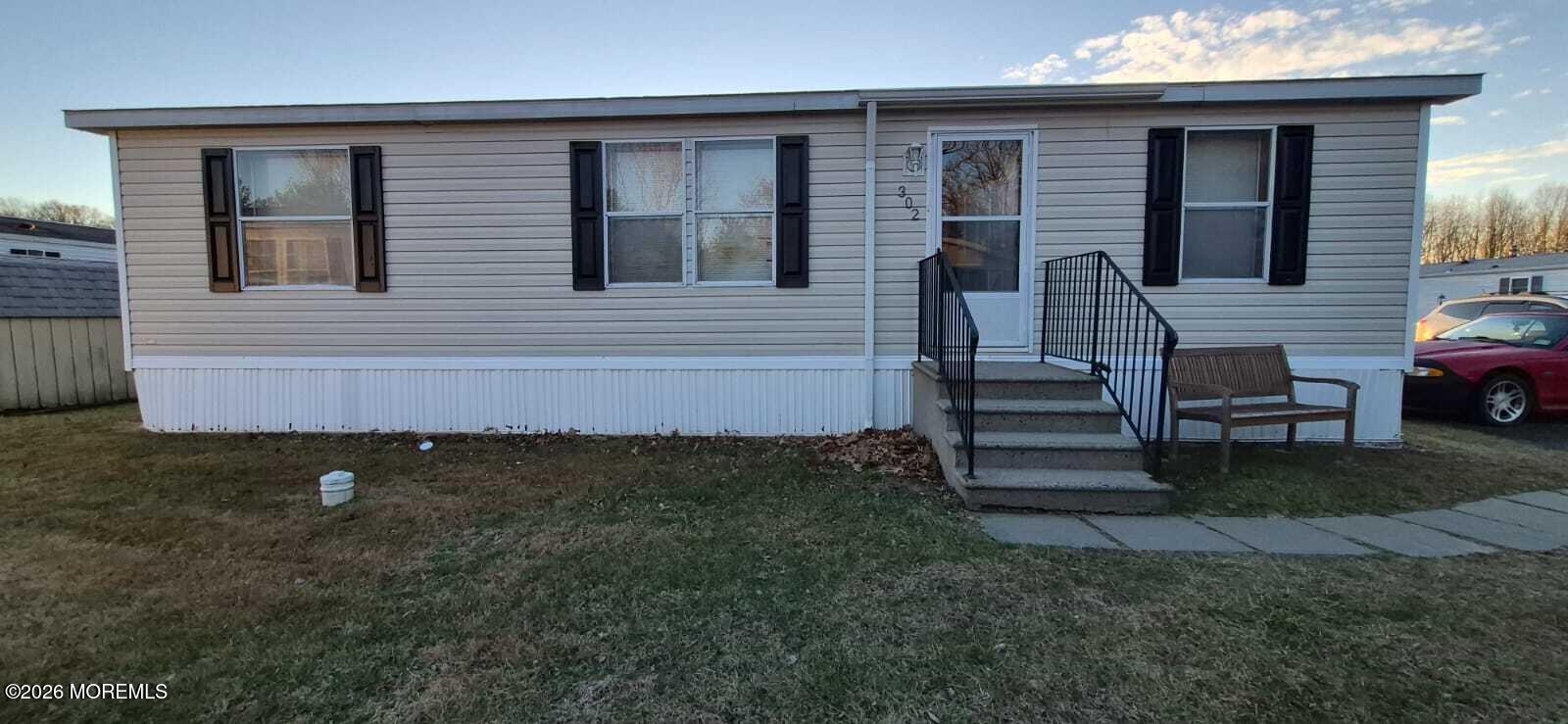 a view of backyard with seating space