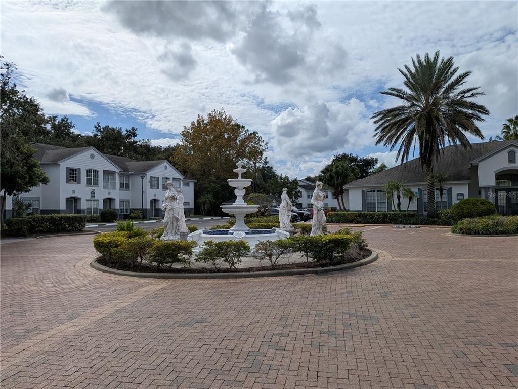 4308 South Kirkman Road, Unit 1 Orlando, FL 32811 - Photo 1 of 24 a front view of a house with a yard and trees