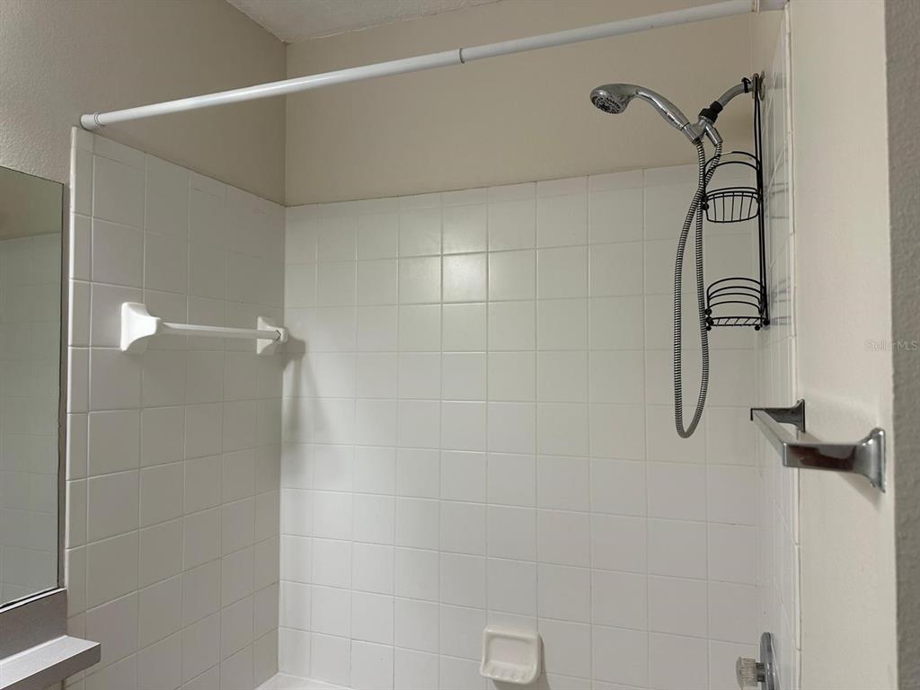 4308 South Kirkman Road, Unit 1 Orlando, FL 32811 - Photo 19 of 24 a bathroom with a shower