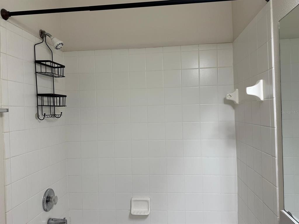 4308 South Kirkman Road, Unit 1 Orlando, FL 32811 - Photo 23 of 24 a bathroom with a shower