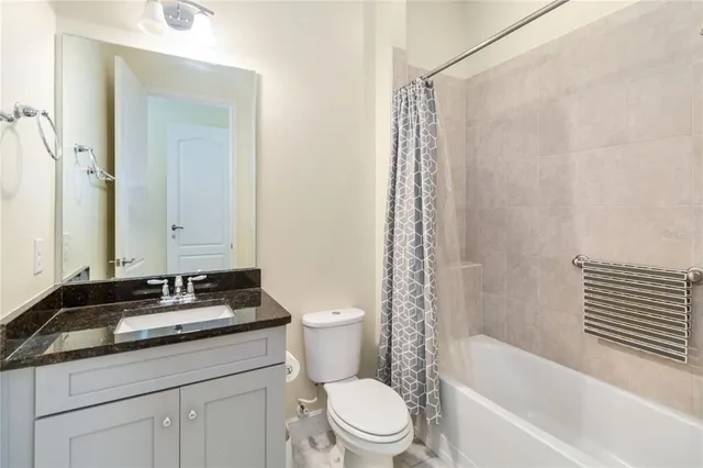 a bathroom with a sink a toilet and a bathtub