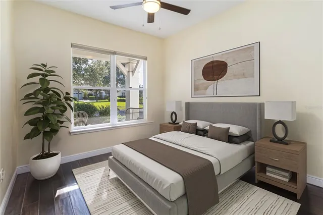 a bedroom with a bed and a large window