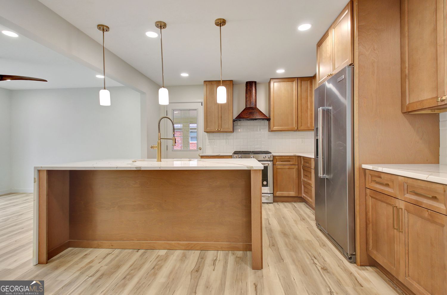 183 Pine Street Northeast Fairburn, GA 30213 - Photo 19 of 68 a kitchen with stainless steel appliances granite countertop a refrigerator a sink and a stove