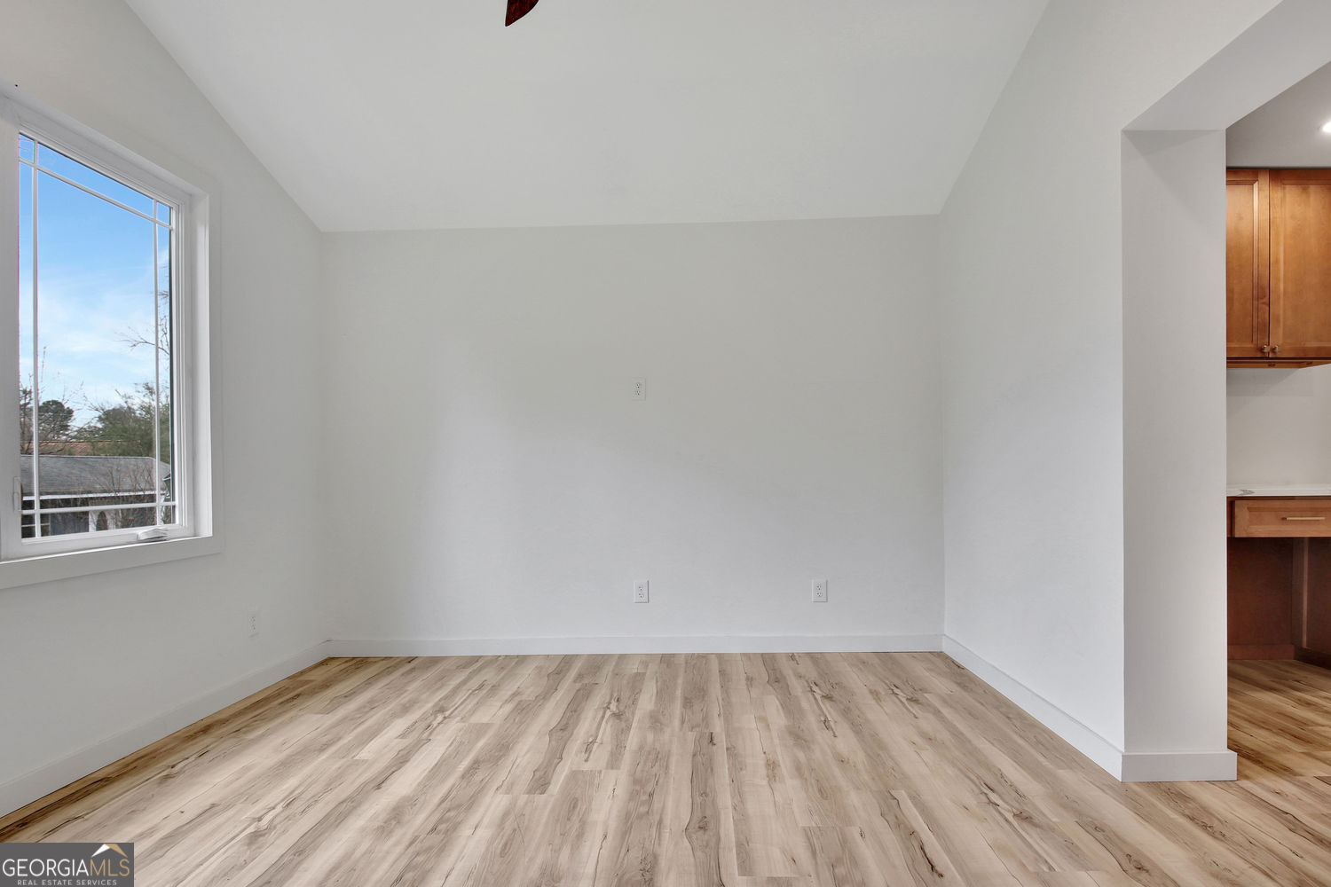 183 Pine Street Northeast Fairburn, GA 30213 - Photo 27 of 68 a view of an empty room and wooden floor