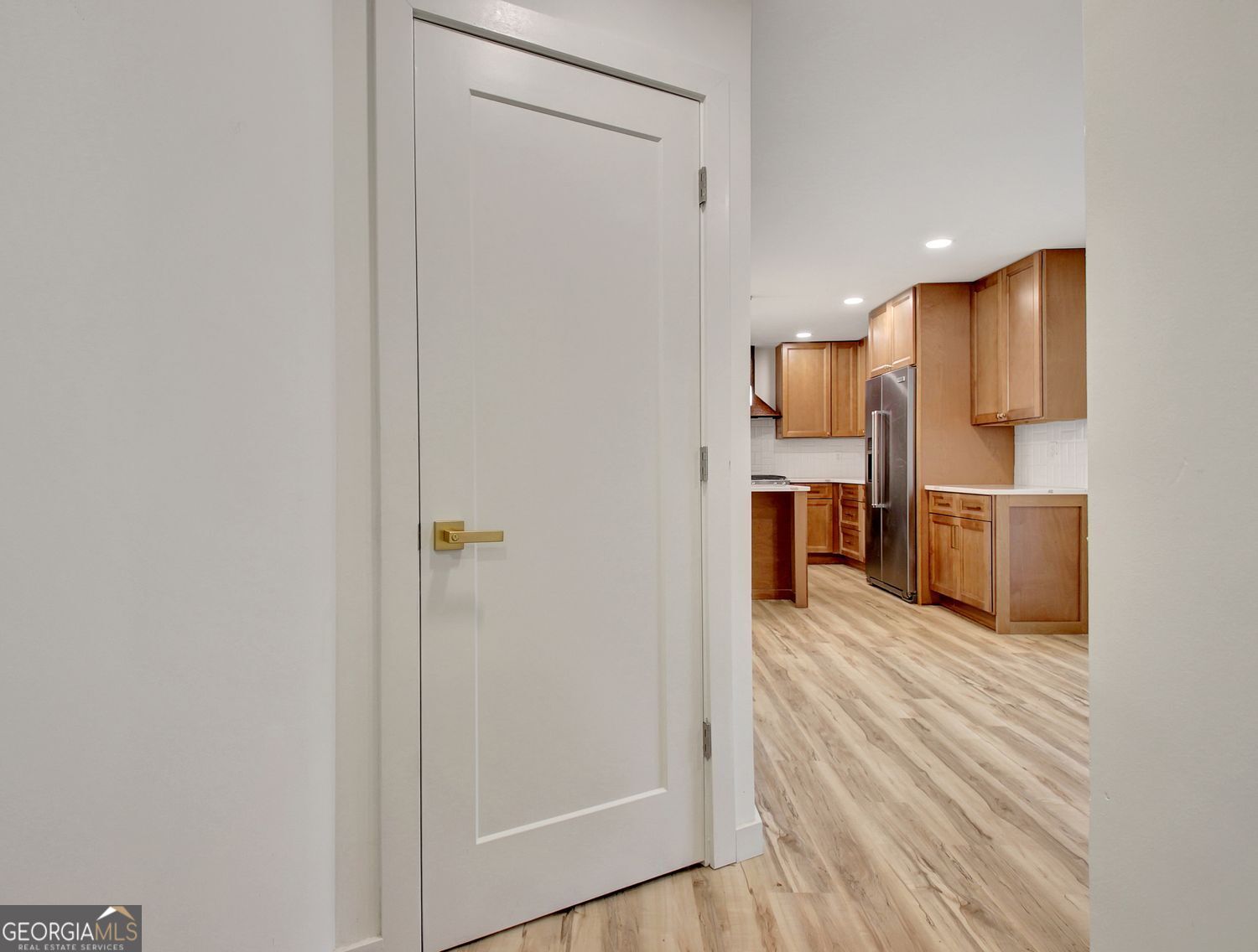 183 Pine Street Northeast Fairburn, GA 30213 - Photo 32 of 68 a view of kitchen with stainless steel appliances wooden floor and chair