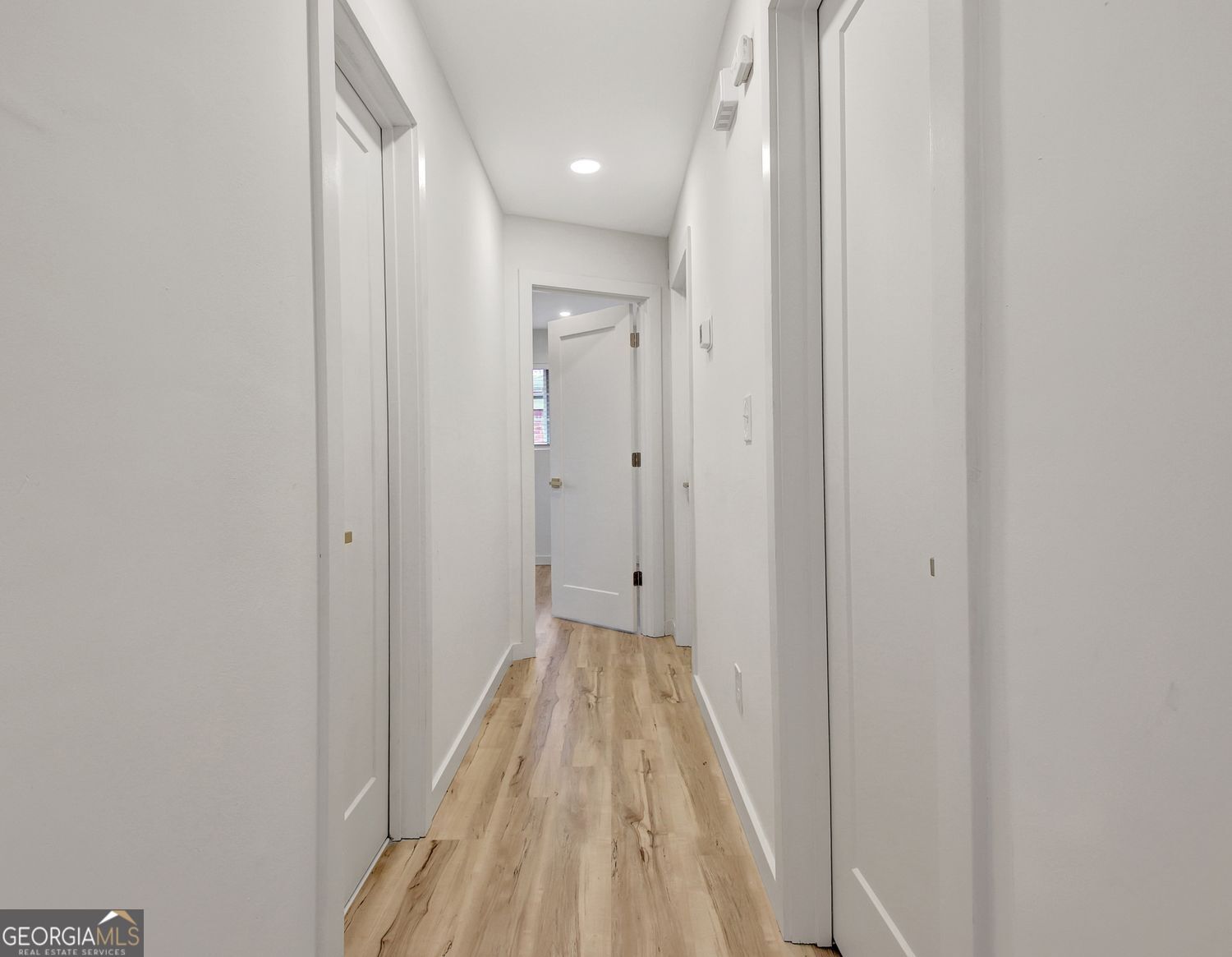 183 Pine Street Northeast Fairburn, GA 30213 - Photo 33 of 68 a view of a hallway with wooden floor