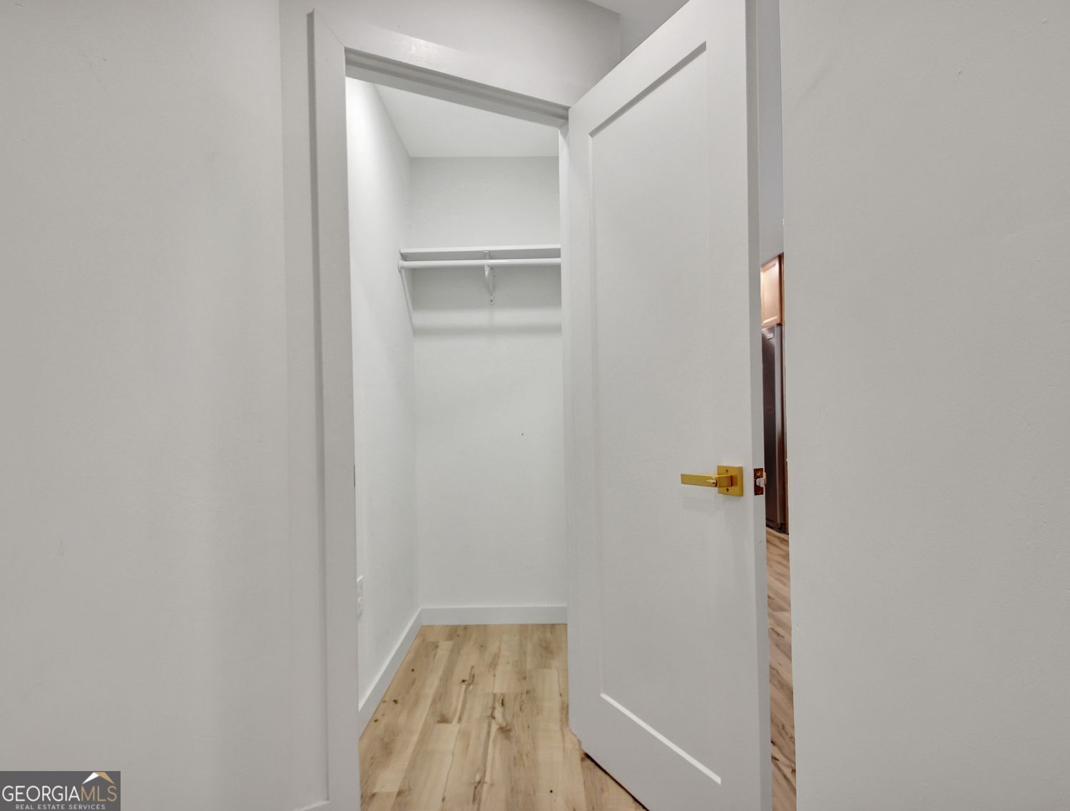 183 Pine Street Northeast Fairburn, GA 30213 - Photo 34 of 68 a view of small space with racks on the wall