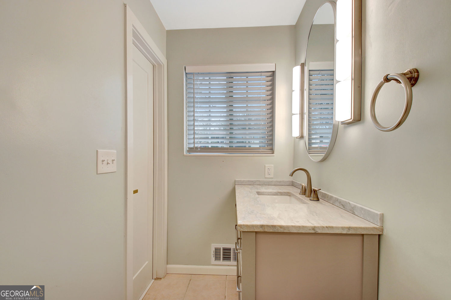 183 Pine Street Northeast Fairburn, GA 30213 - Photo 39 of 68 a bathroom with a granite countertop sink a mirror and a window