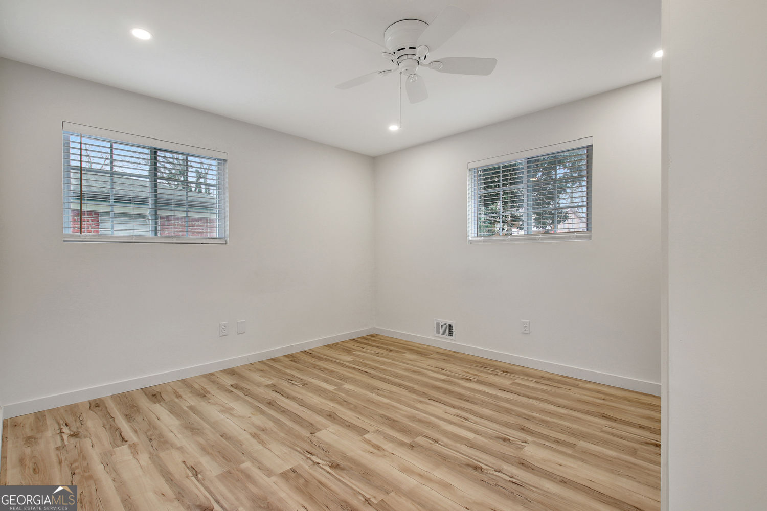 183 Pine Street Northeast Fairburn, GA 30213 - Photo 42 of 68 a view of empty room with wooden floor