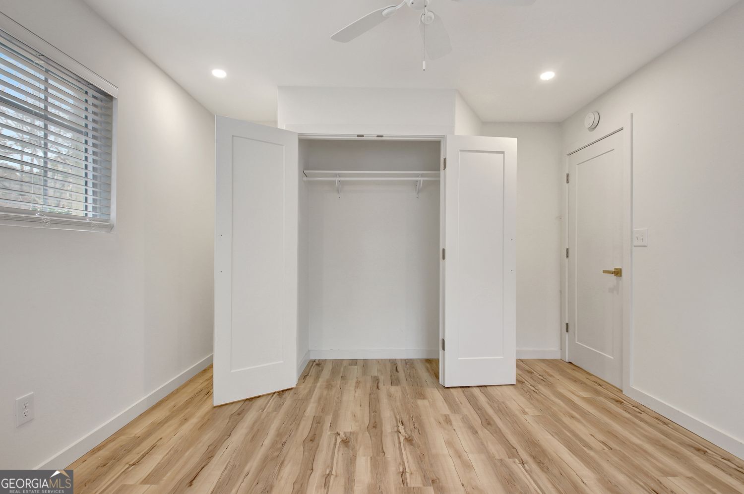 183 Pine Street Northeast Fairburn, GA 30213 - Photo 47 of 68 a view of empty room with wooden floor