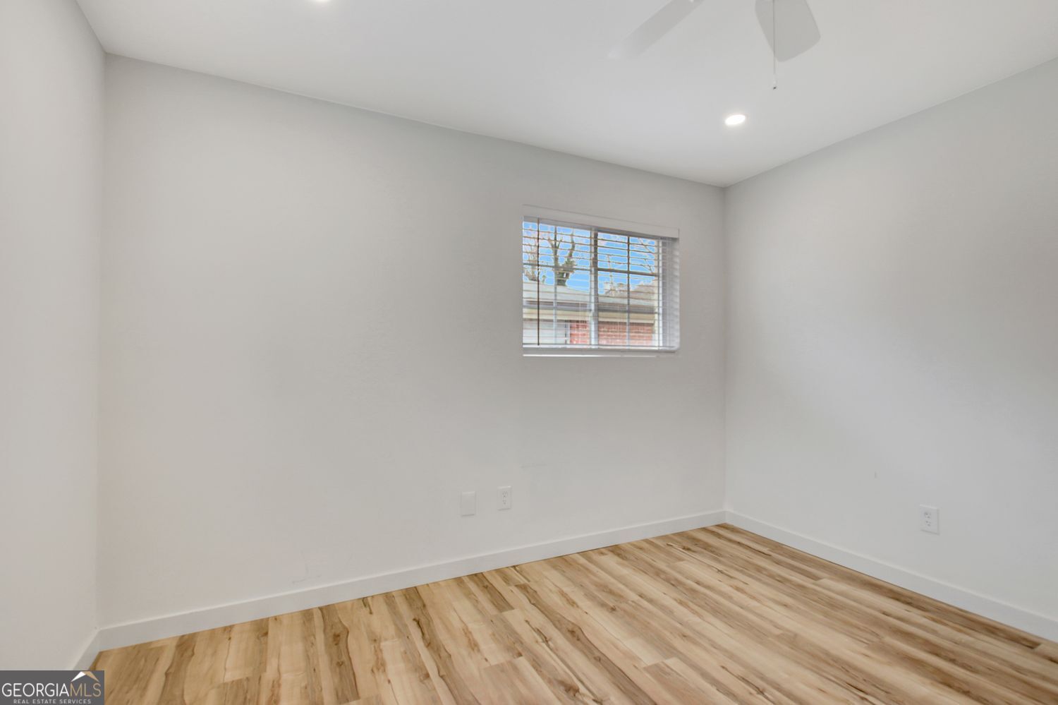 183 Pine Street Northeast Fairburn, GA 30213 - Photo 54 of 68 an empty room with a window